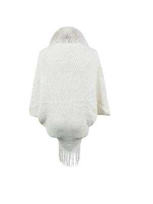 White textured knit poncho with faux fur collar and fringe detail