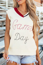 White knit vest with burgundy trim and "Game Day" embroidery.