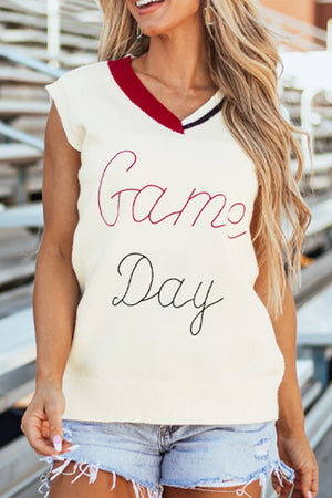White knit vest with burgundy trim and "Game Day" embroidery.