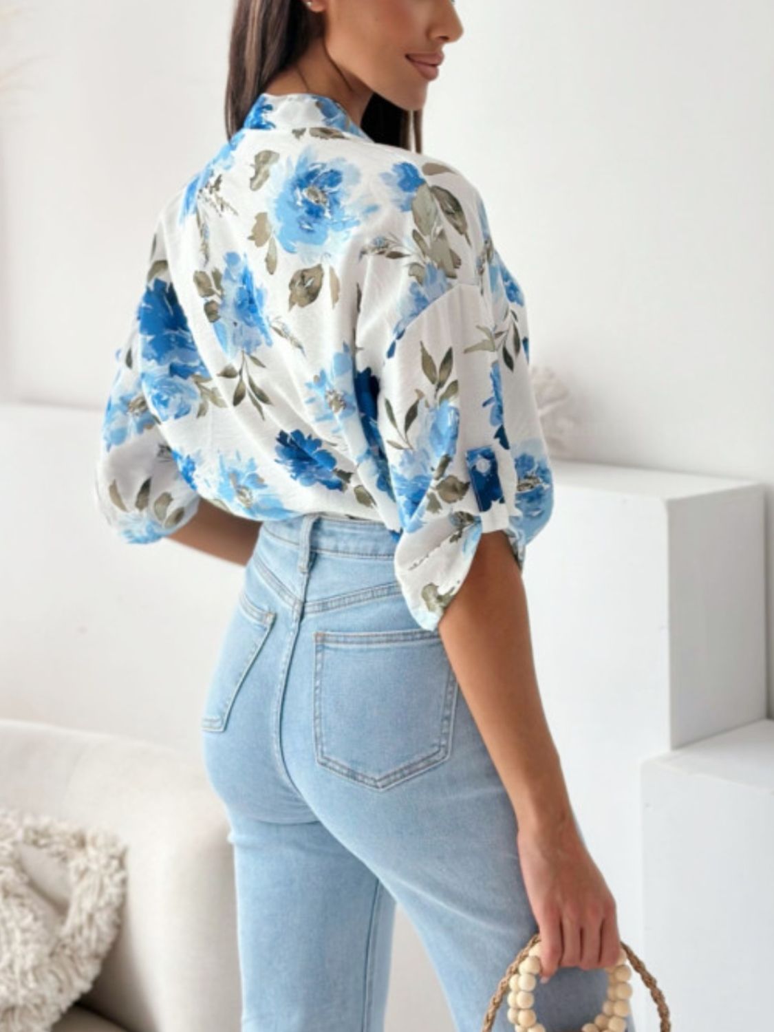 Floral print blouse with mandarin collar in Royal Blue, featuring button details and short sleeves.
