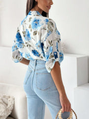 Floral print blouse with mandarin collar in Royal Blue, featuring button details and short sleeves.