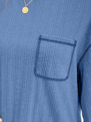 Blue ribbed knit top with contrast stitch pocket detail