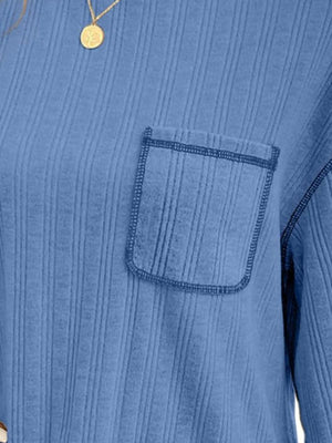 Blue ribbed knit top with contrast stitch pocket detail