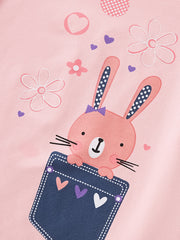 Pink toddler t-shirt with a cute bunny graphic peeking out of a denim pocket.