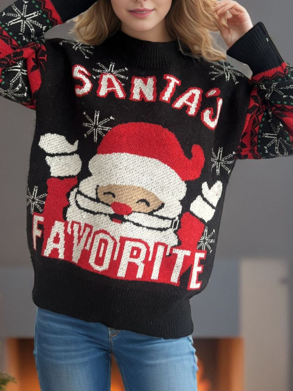 Black acrylic knit sweater with Santa graphic and "Santa's Favorite" text.