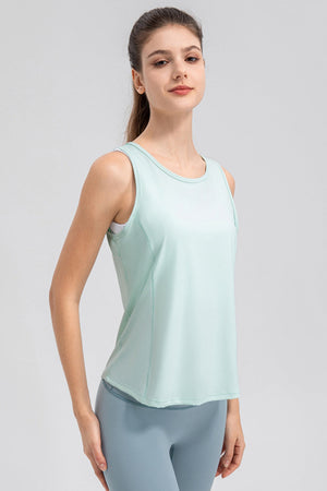 Light green performance tank top with curved back panel detail and scoop neckline.