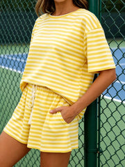 Casual striped tee and drawstring shorts ensemble in yellow, khaki, blue, or pink.