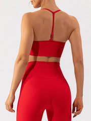 Red ribbed halterneck active bra with adjustable strap detail.