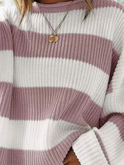 Striped oversized knit sweater in dusty pink and white with a crew neck.