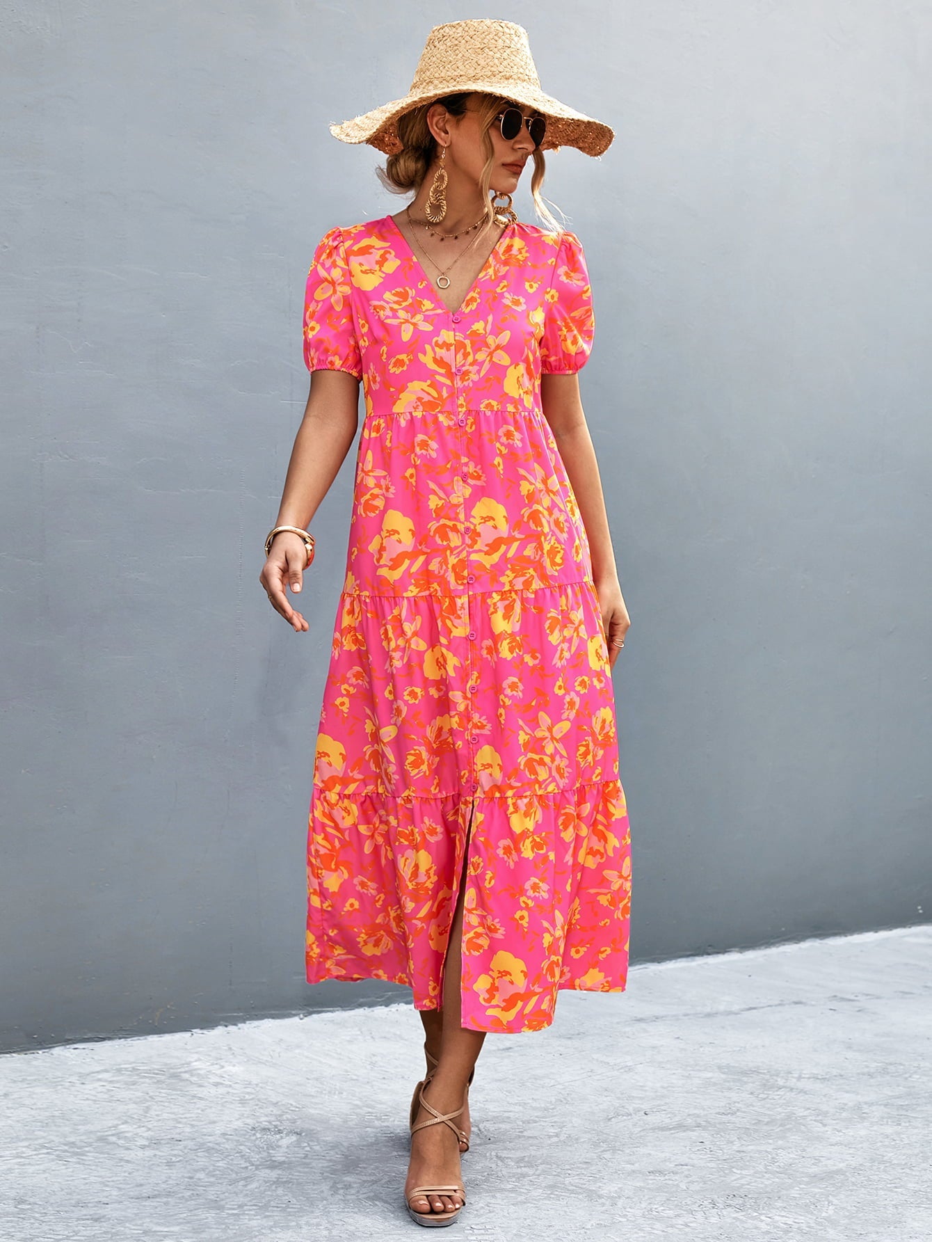 Hot pink midi dress with orange-red floral print, puff sleeves, V-neck, and tiered skirt.