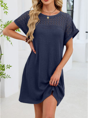 Dark blue t-shirt dress with sheer lace yoke and short sleeves.