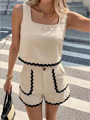 Scalloped trim tank and shorts set in beige with black trim. Square neck tank top and high-waisted shorts.