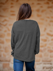 Dark Gray waffle knit relaxed fit crewneck top with long sleeves.