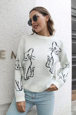 White acrylic sweater with black cat intarsia knit pattern, crew neck, long sleeves.