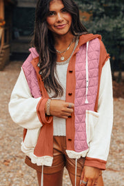 Colorblock quilted hooded waffle jacket in dusty pink with white sleeves and orange accents.