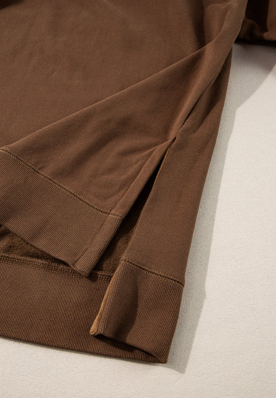 Brown loungewear set with side slits on the hem and ribbed cuffs.