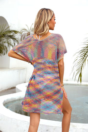 Open-knit caftan with rainbow stripes and slit hem, short sleeves, V-neck.