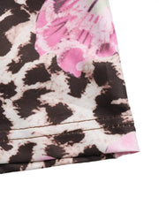 Leopard floral bodycon maxi skirt with blush pink accents and detailed stitching.