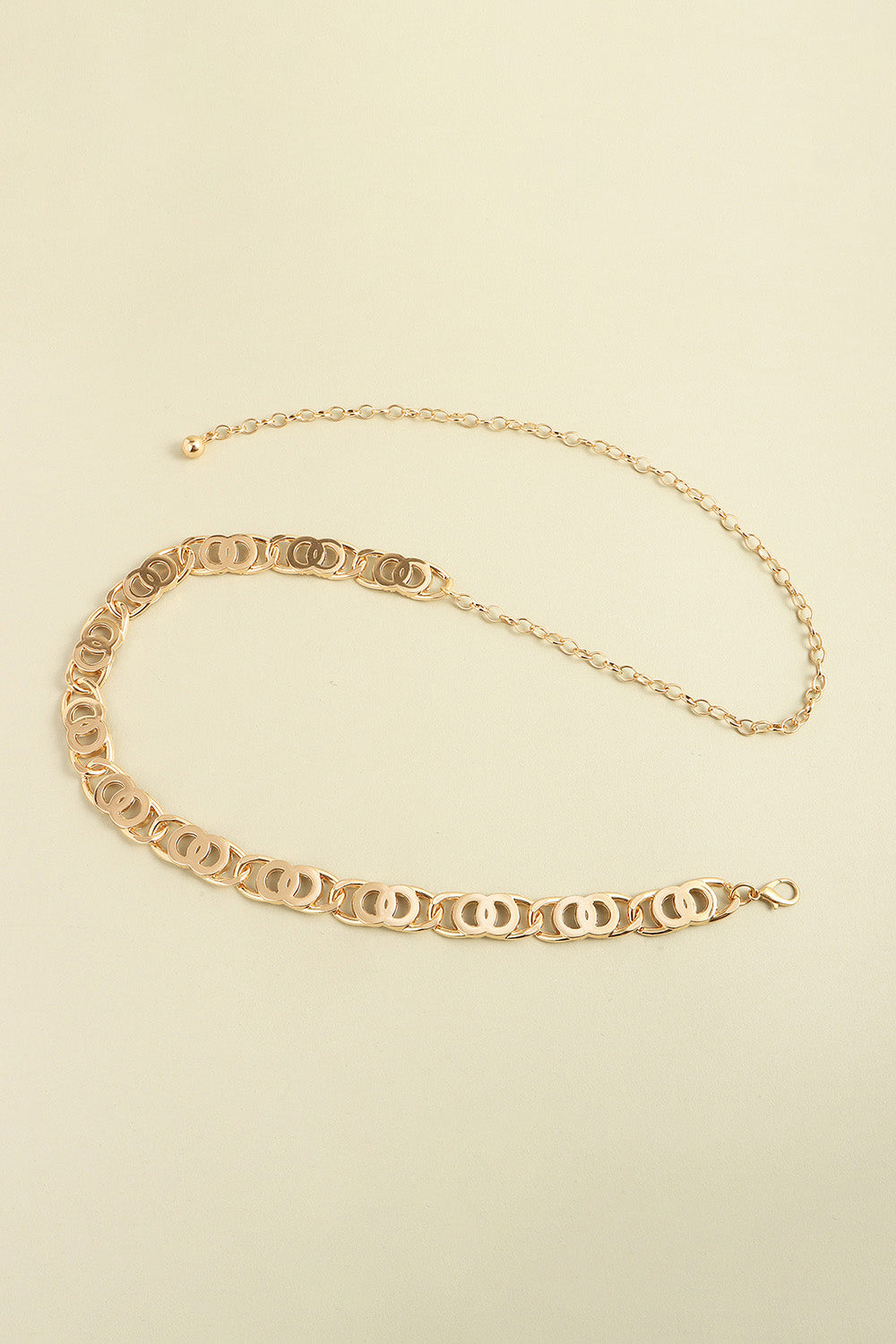 Golden circle chain belt with adjustable clasp and extender chain.