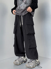 Black cargo sweatpants with drawstring and multiple pockets.