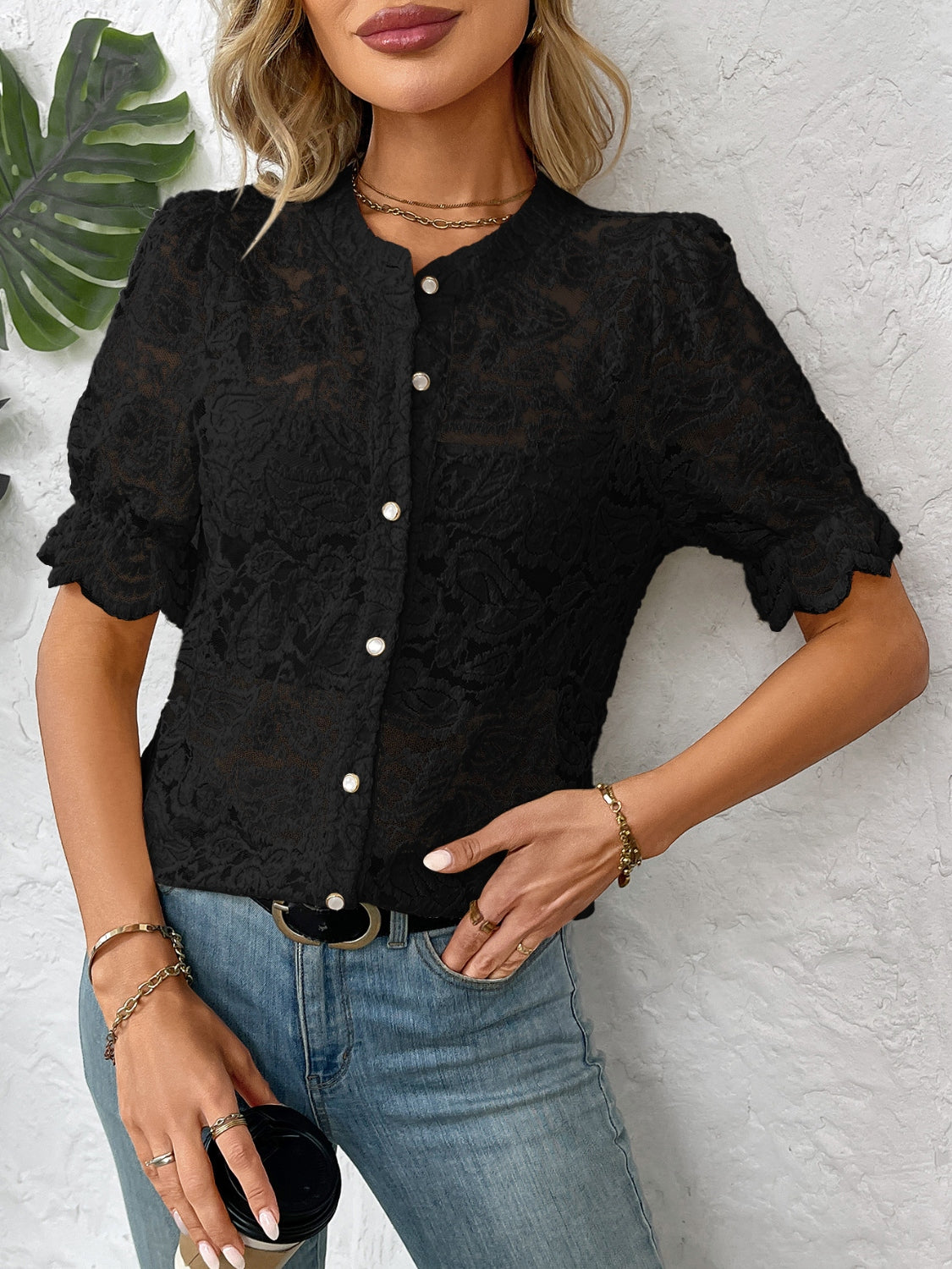 Black floral lace blouse with mandarin collar, puff sleeves, and pearl buttons.