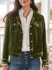 Dark green velvet jacket with silver buttons and chest pockets.