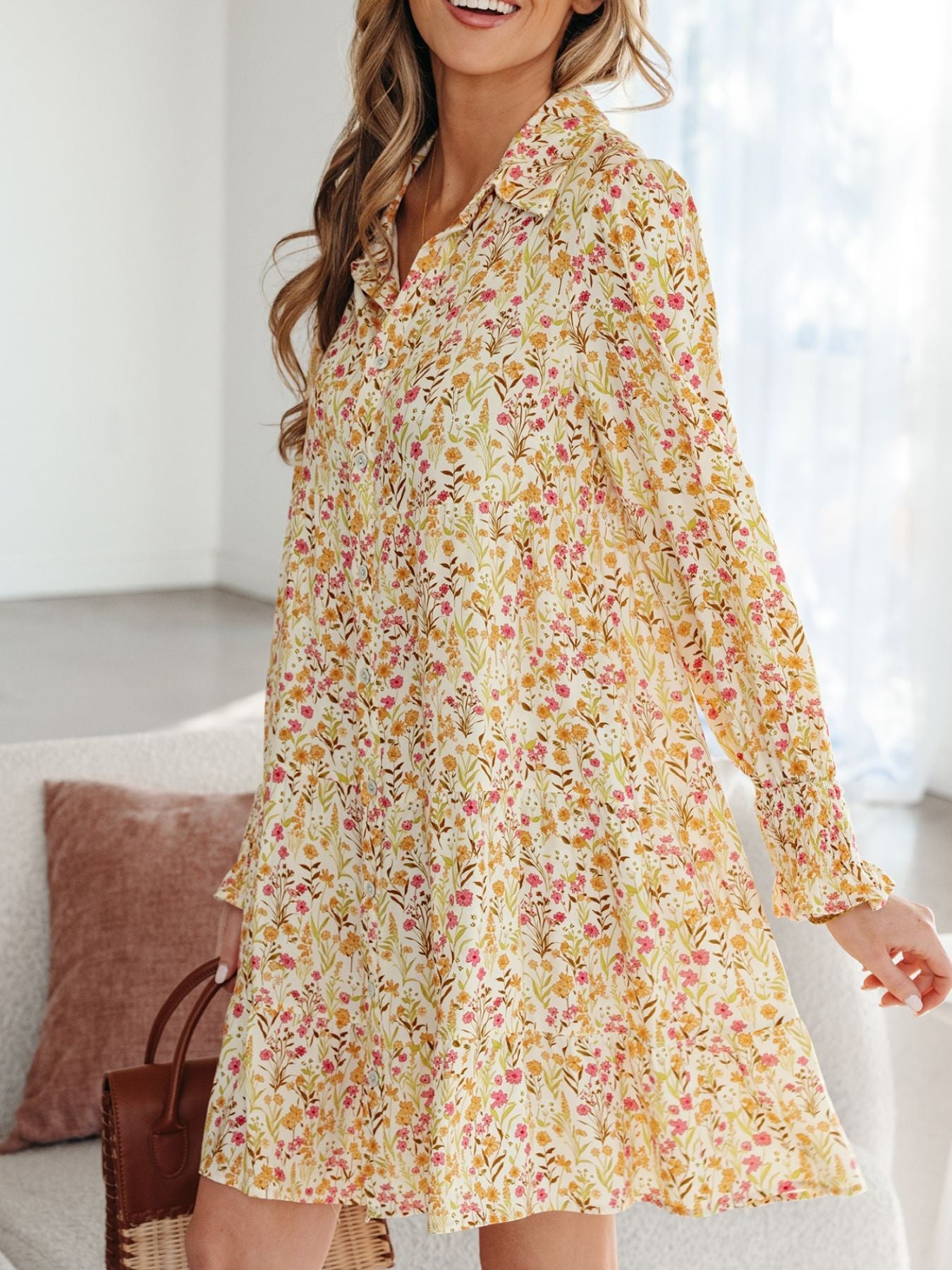 Floral print button-down shirt dress with long sleeves and a loose fit.