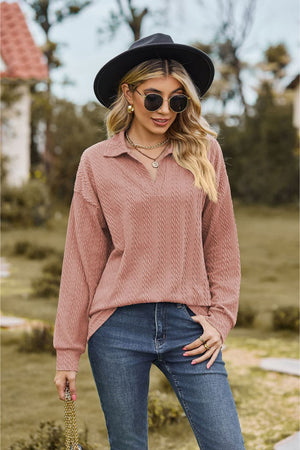 Dusty Pink textured cable knit polo top with a V-neck and long sleeves.