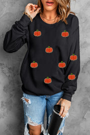 Black crewneck sweatshirt with allover embroidered pumpkin patches.