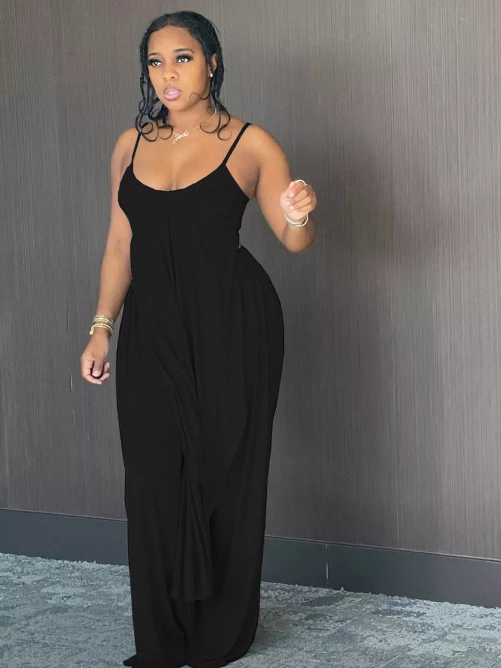 Black cami and wide-leg pants set with asymmetrical hem.