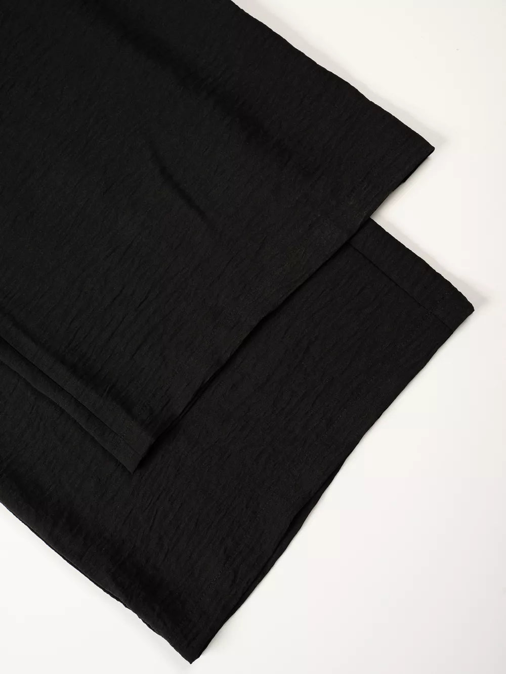 Black relaxed wide-leg maternity pants with textured fabric detail
