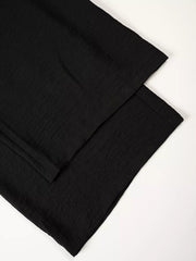 Black relaxed wide-leg maternity pants with textured fabric detail