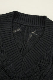 Black openwork knit V-neck pullover sweater with textured stitch details.