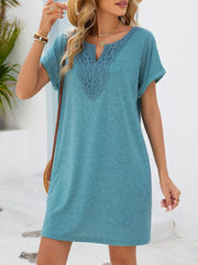 Dusty blue V-neck dress with lace trim and short sleeves.