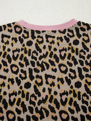 Leopard print loungewear top with pink crew neck and ribbed trim.