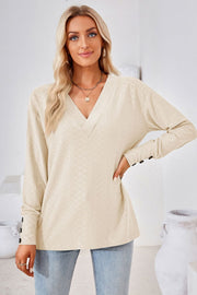 Textured V-neck blouse in cream with button cuff detail