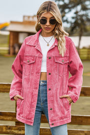 Oversized coral denim trucker jacket with classic buttoned front and chest pockets.