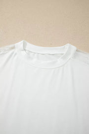 White long sleeve shirt with crew neck and delicate lace shoulder detail