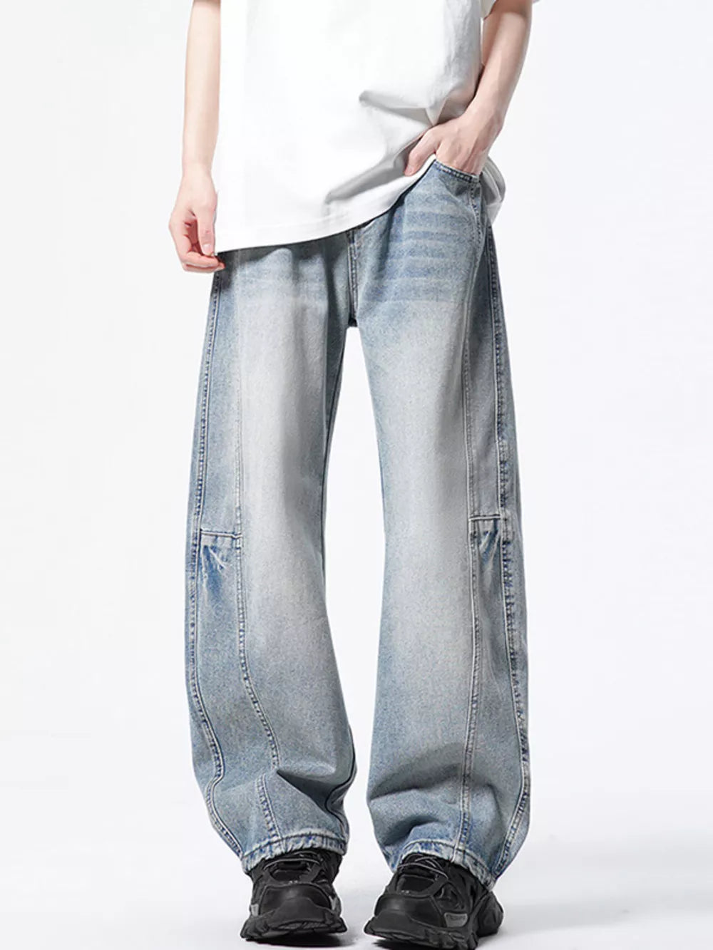 Light wash denim wide-leg jeans with a vintage look and relaxed fit.