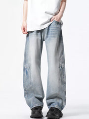 Light wash denim wide-leg jeans with a vintage look and relaxed fit.