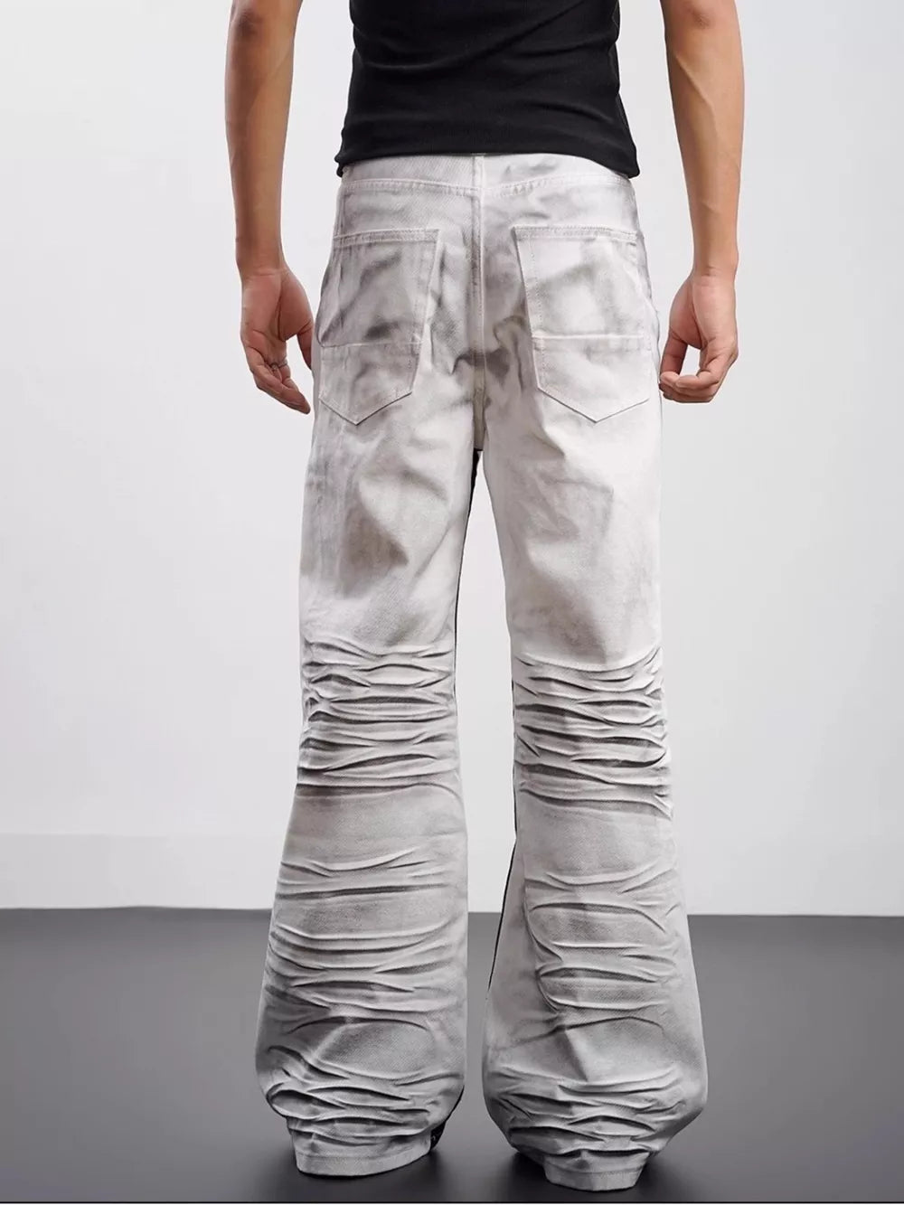 Men's wide-leg jeans in grey with contrast stripe detail and ruched legs.