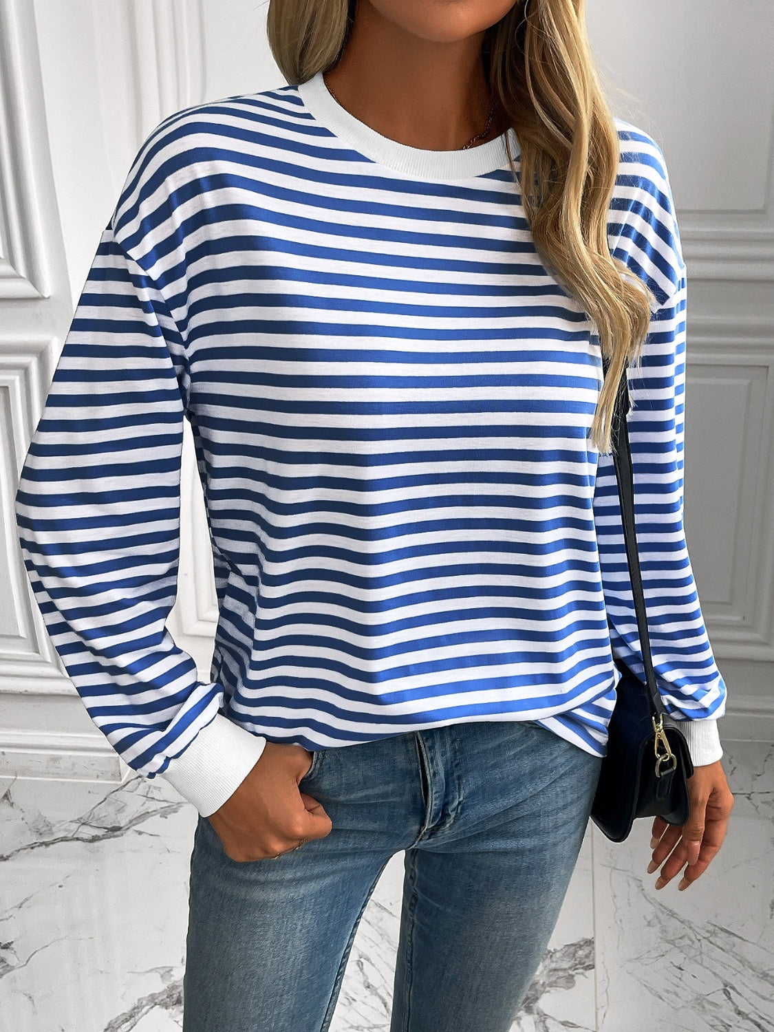 Horizontal stripe crewneck sweatshirt with white cuffs in Royal Blue and white.