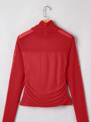 Sheer mesh patchwork high neck long sleeve maternity top in deep red with ruched sides.