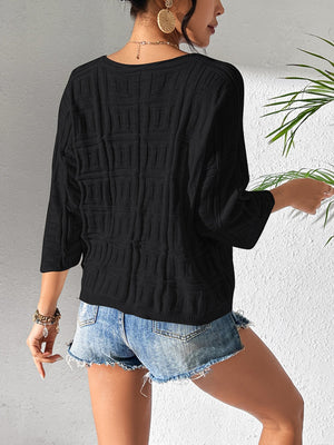 Black textured knit dolman sleeve sweater with square pattern detail and 3/4 sleeves.