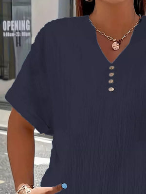 Navy blue textured V-neck t-shirt with decorative buttons and short sleeves.