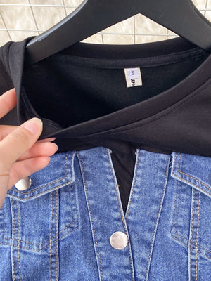 Denim patchwork short-sleeve dress with button details and a black top.