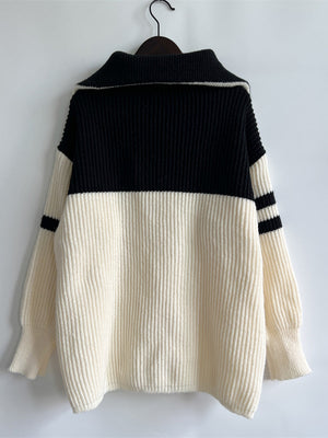 Varsity stripe ribbed collar sweater in black and white acrylic with a relaxed fit.
