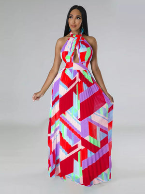 Halter neck maxi dress with geometric print and pleats in red, blue, green, and purple.