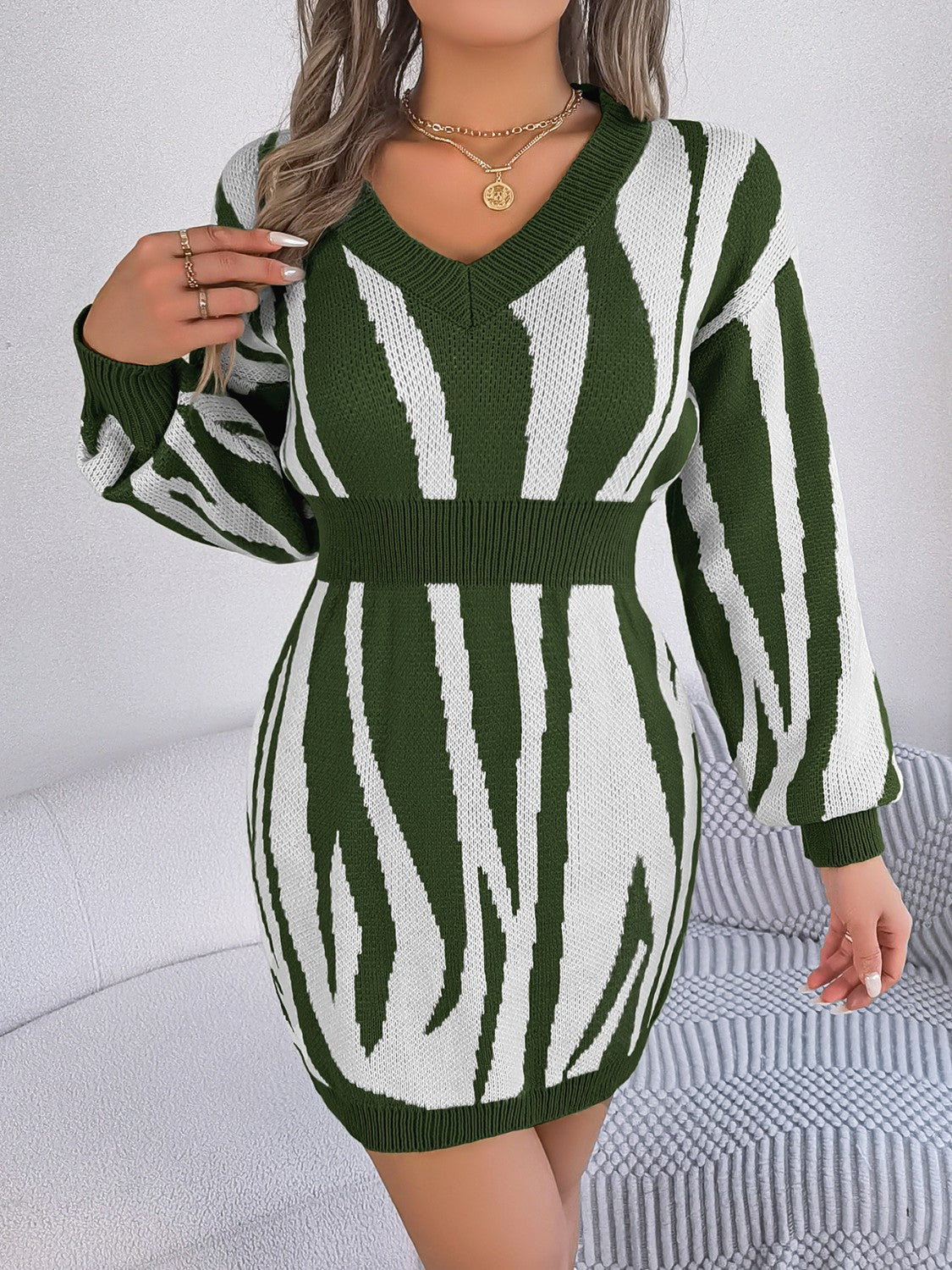 Army green and white zebra stripe knit fit-and-flare dress with V-neck and cinched waist.