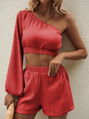 Orange-Red textured one-shoulder crop top and shorts set with balloon sleeve.